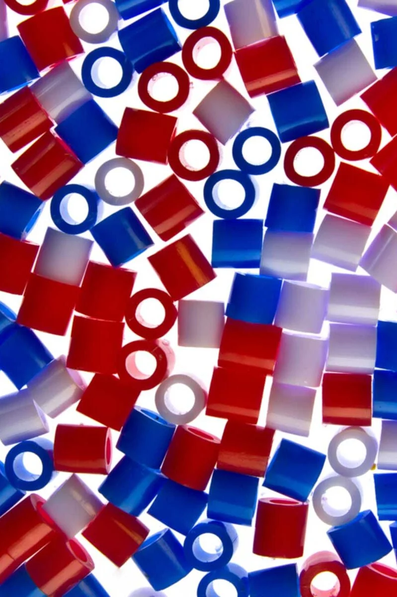 Colorful plastic beads in red, white, and blue